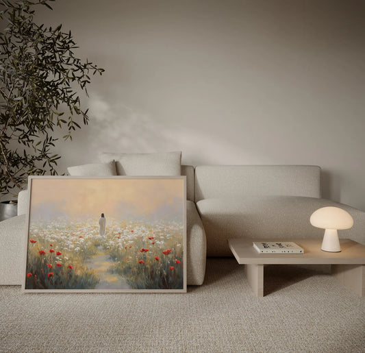 Jesus walking through white wildflowers at sunset with mountain backdrop art print displayed infront a sofa in a warm neutral living room – JesusArtworks