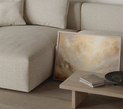 Empty Tomb christian art print leaning against sofa showing golden light and ethereal clouds, resurrection wall art close-up