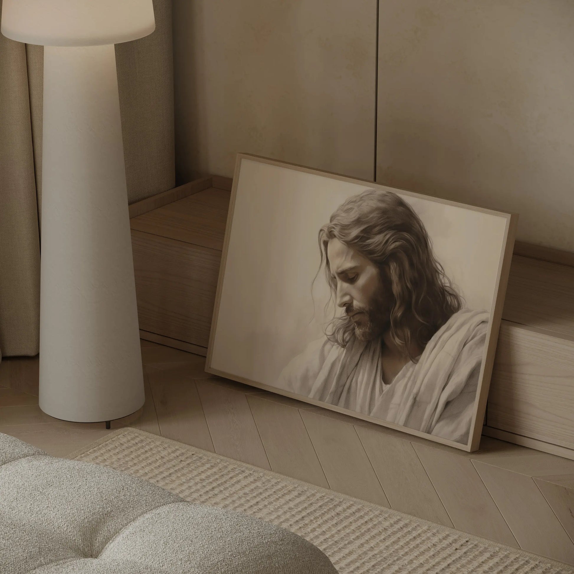 Christian wall art print of Jesus with bowed head displayed in a modern neutral interior