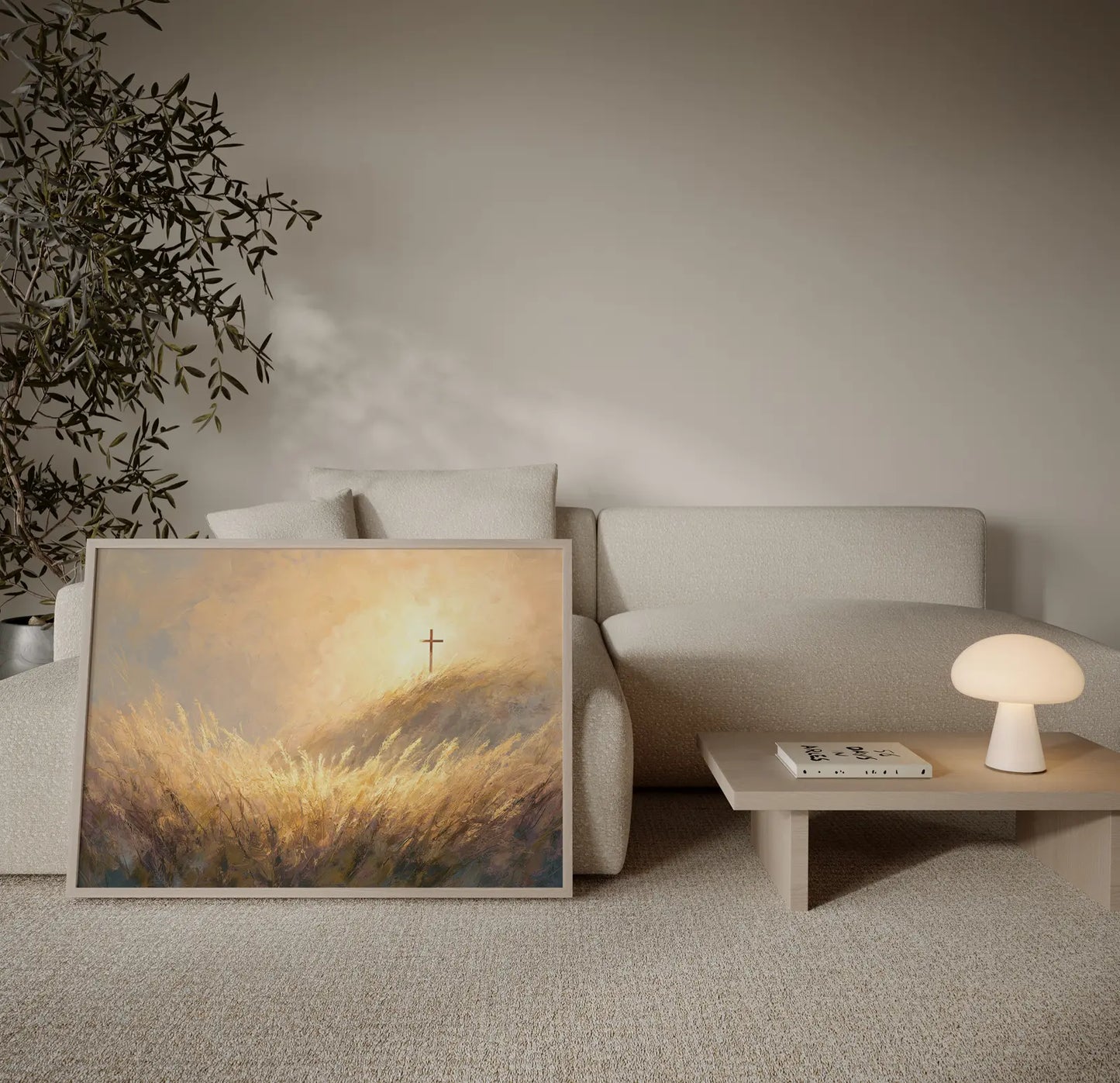 Sunrise cross painting on a golden hilltop surrounded by swaying wheat grass, framed and leaning beside a cream couch