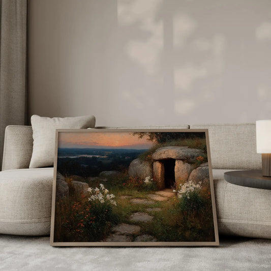 Before the World Woke dramatic oil painting – the empty tomb at dawn surrounded by white Easter lilies and orange wildflowers, glowing sunset sky over a dark valley with distant city lights, Christian wall art by JesusArtworks