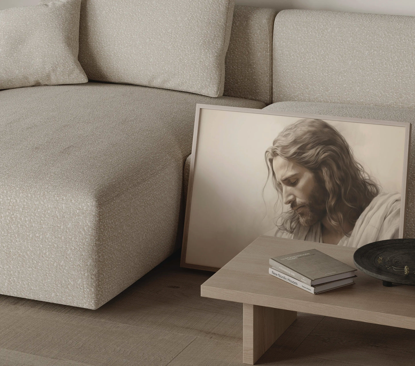 Contemplative Jesus wall art print leaning against a cream sofa — modern Christian home decor