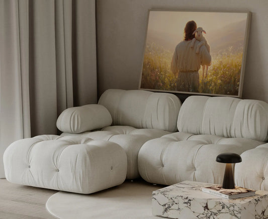 Jesus shepherd and lamb journey's end sunset art print in a softly lit neutral living room above a linen sofa – Christian home decor by JesusArtworks