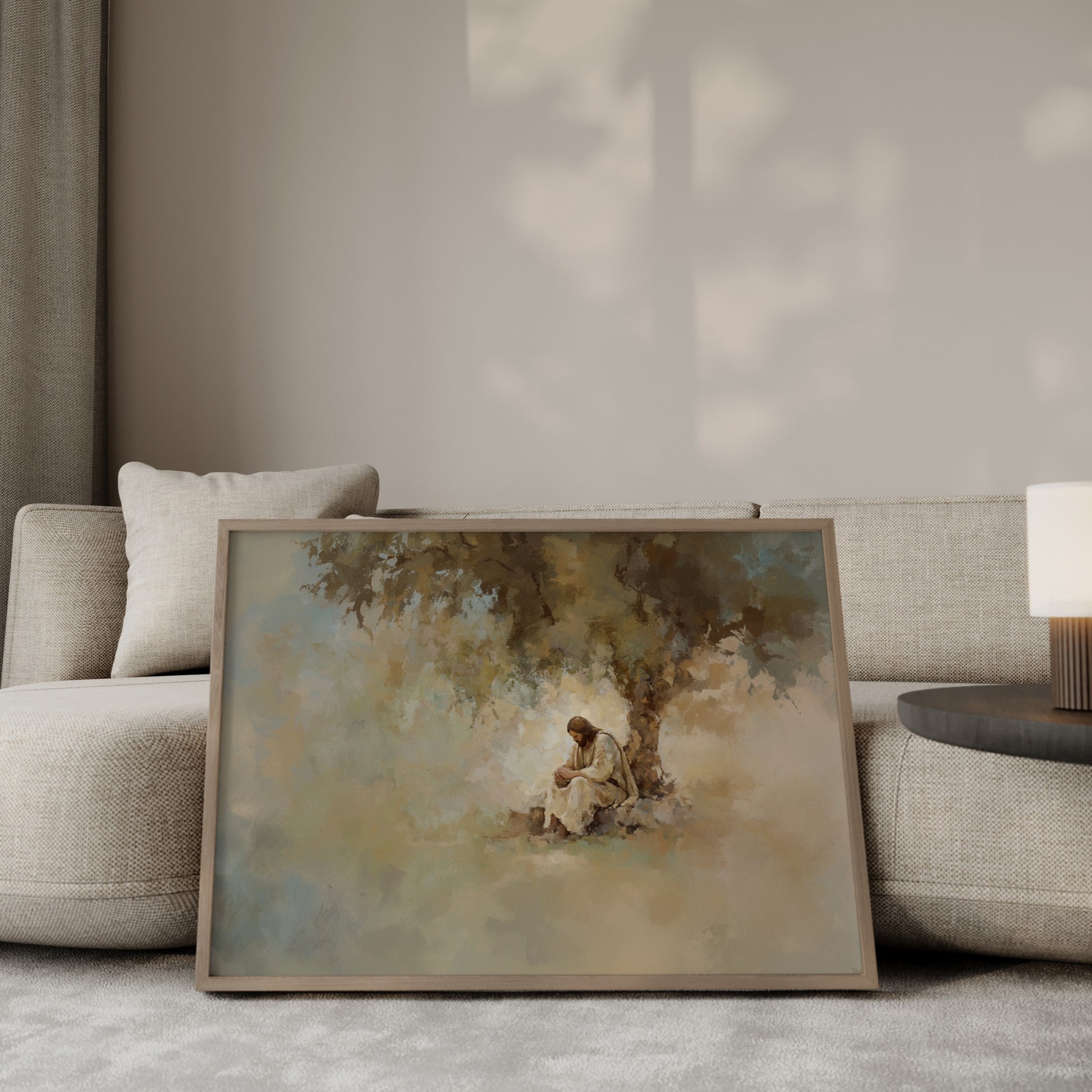 Christian artwork showing Jesus meditating under a tree, rendered in a tonal, impressionist style with gentle light filtering through leaves.