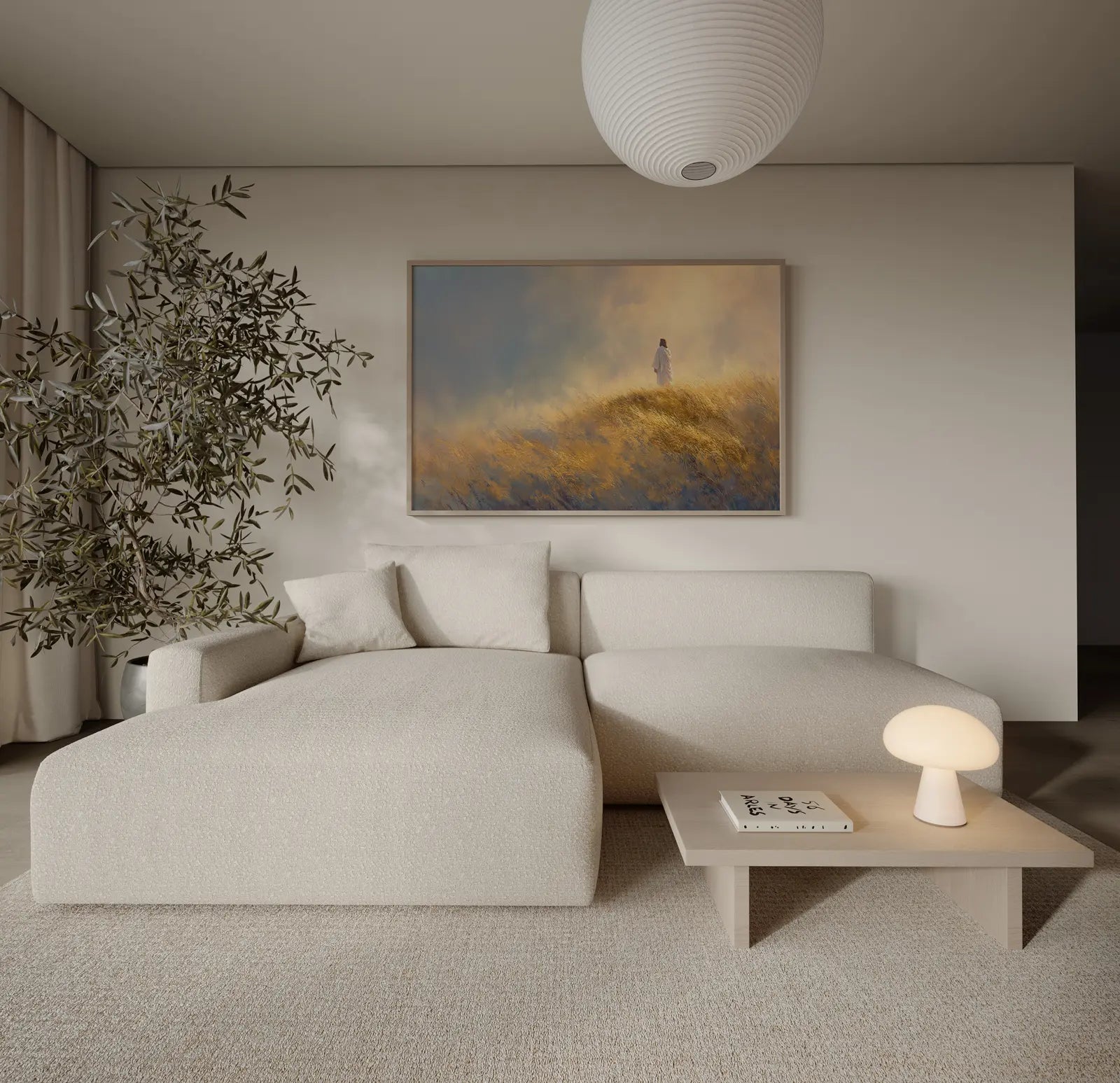 Minimalist Christian landscape painting of Jesus walking a golden ridge, framed and leaning beside a cream couch in a modern home