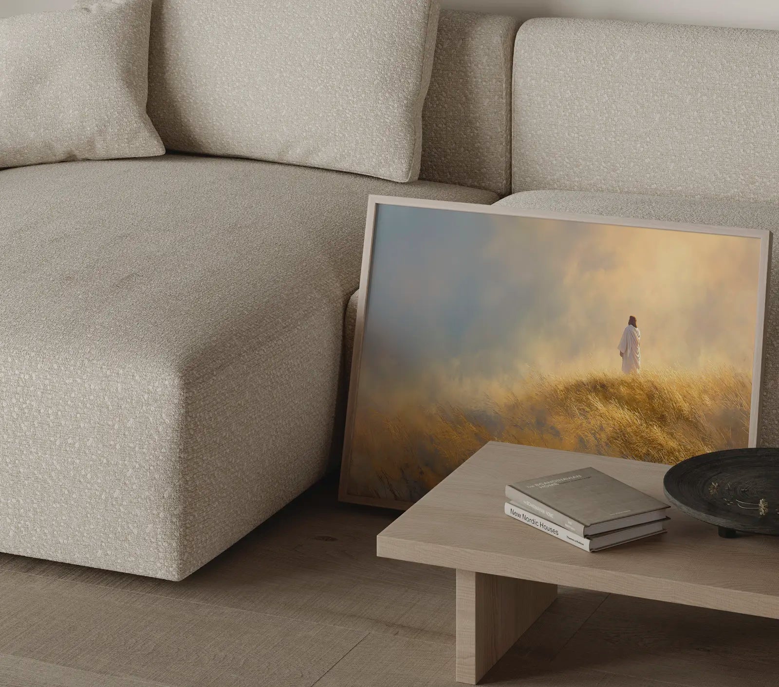 Jesus walking alone wall art print with warm golden and blue tones in a thin frame in a modern neutral living room – JesusArtworks