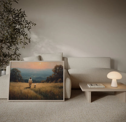 Jesus walking with a lamb in a golden field at sunset Christian art print displayed above a sofa in a warm neutral living room – JesusArtworks