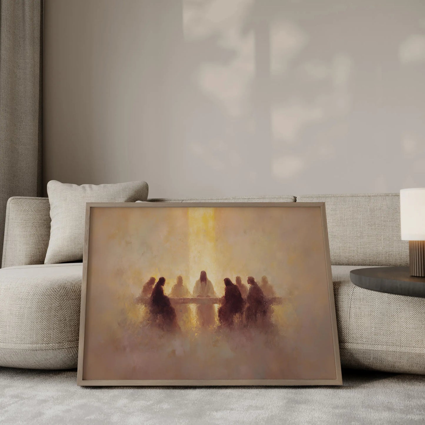 The Covenant Meal Last Supper wall art print in a gold frame leaning against a beige sofa – Christian home decor by JesusArtworks