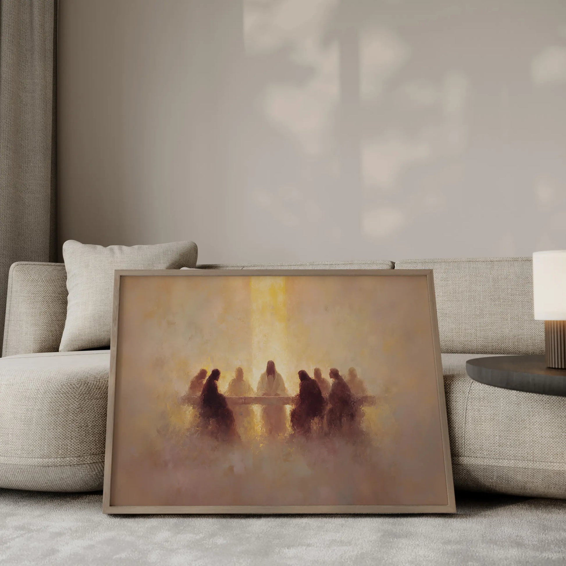 The Covenant Meal Last Supper wall art print in a gold frame leaning against a beige sofa – Christian home decor by JesusArtworks